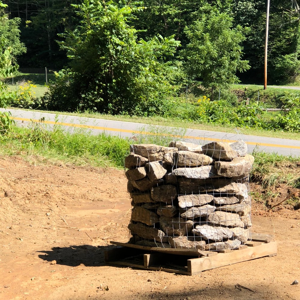 pallet of rocks for ditch drainage